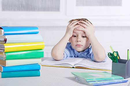 Frustrated_Boy_with_books